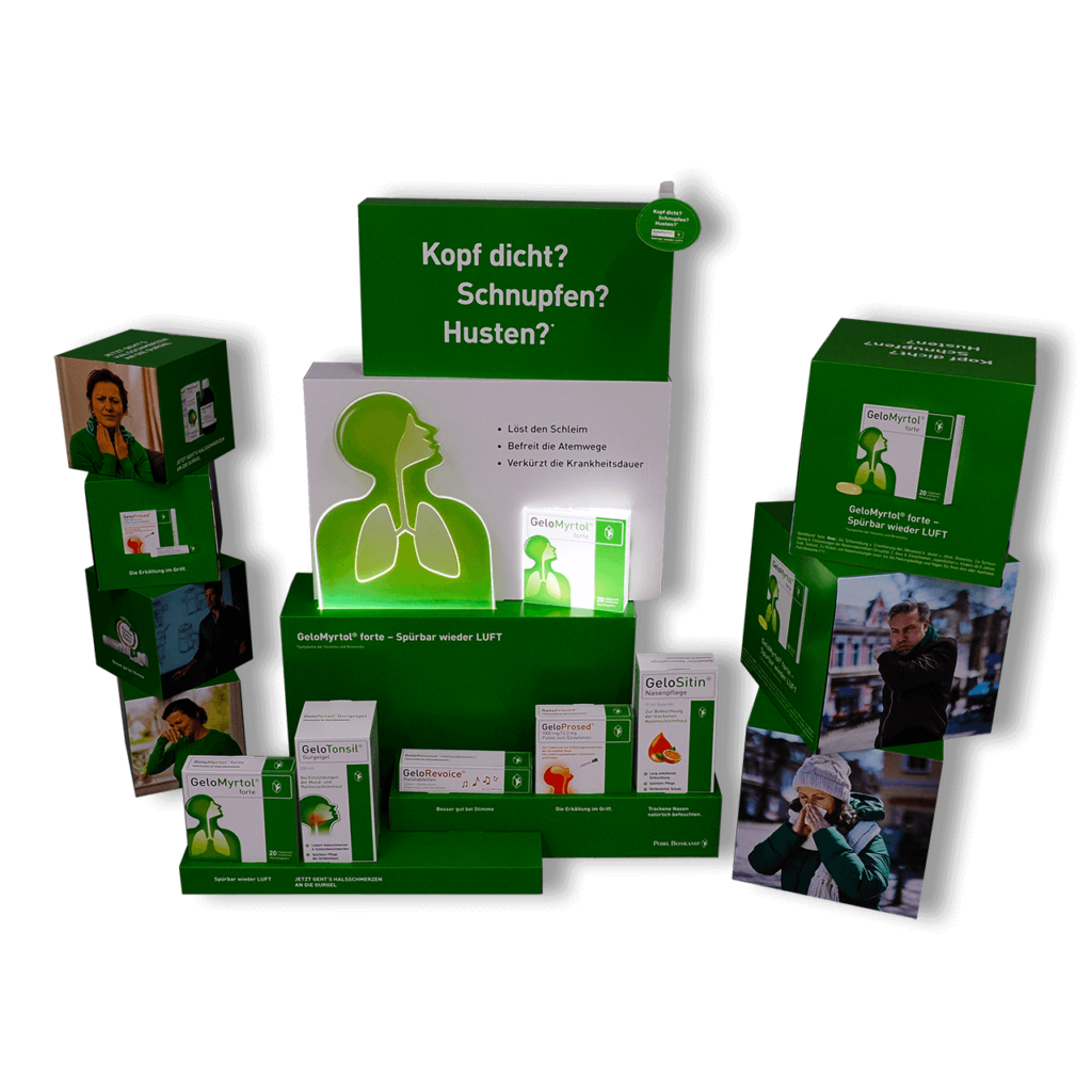 Schaufensterdekoration mit Beleuchtung von pod GmbH für die Medikamente GeloMyrtol, GeloTonsil u. a. - bestehend aus einer Kombination mehrerer verschieden großer Würfeln und Rechtecke